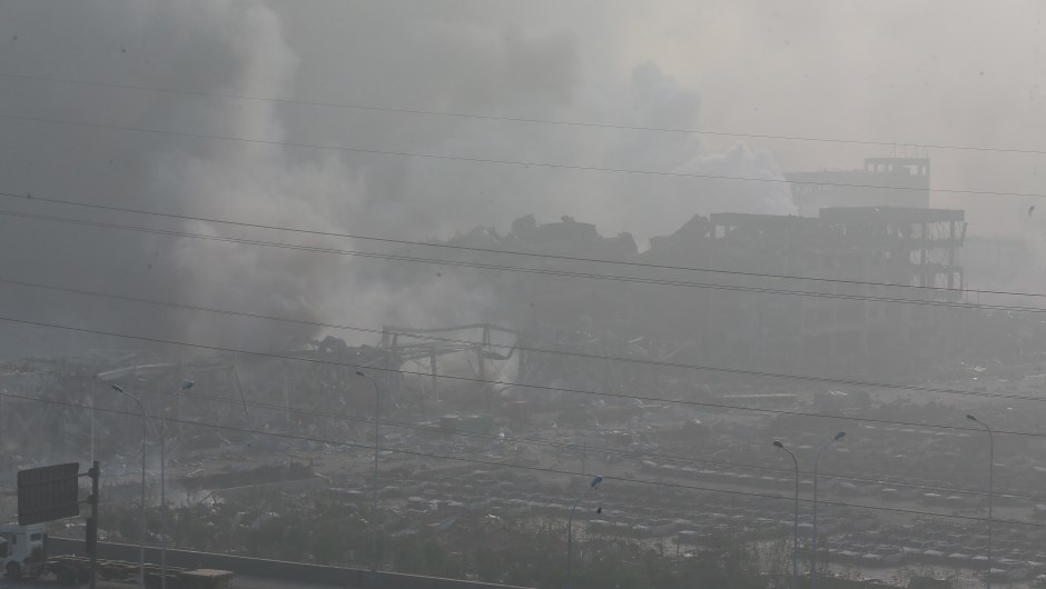 TIANJIN, CHINA - AUGUST 13: (CHINA OUT) Accident site is still smoking after explosions of a warehouse on late Wednesday in Binhai New Area on August 13, 2015 in Tianjin, China. At least 17 people dead, 32 are in critical condition and at least another 400 injured during the explosions of a warehouse on late Wednesday in Binhai New Area in Tianjin, according to police authority. (Photo by ChinaFotoPress/ChinaFotoPress via Getty Images)