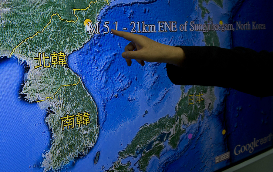 Kuo Kai-wen, director of Taiwan's Seismology Center, points at the locations from a monitor showing North Korea's first hydrogen bomb test site, in Taipei on January 6, 2016. North Korea said it had carried out a 'successful' miniaturised hydrogen bomb test -- a shock announcement that, if confirmed, would massively raise the stakes in the hermit states bid to strengthen its nuclear arsenal. AFP PHOTO / Sam Yeh / AFP / SAM YEH (Photo credit should read SAM YEH/AFP/Getty Images)