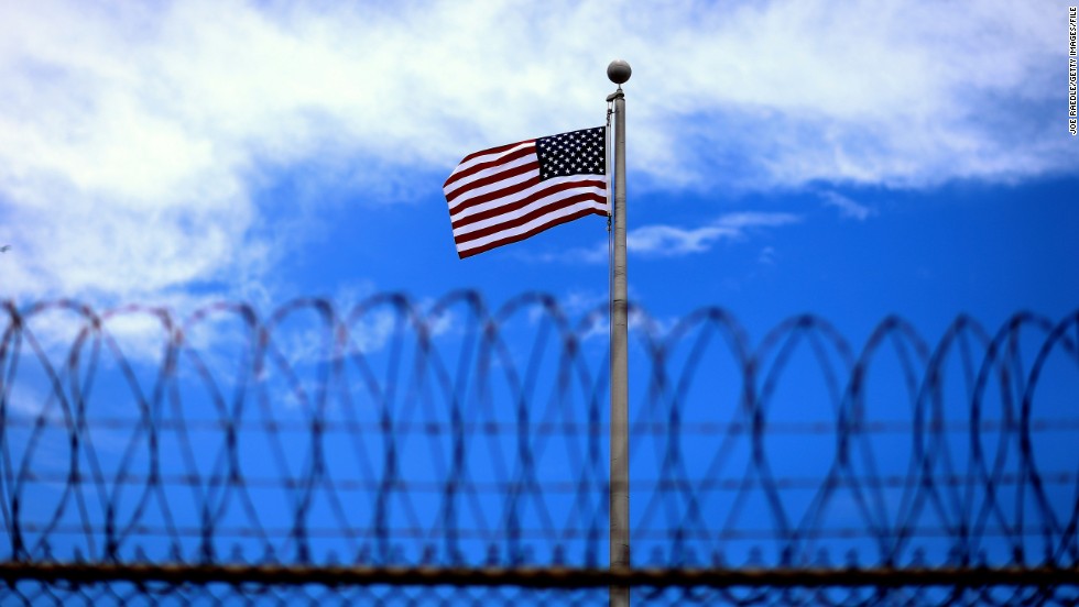 GUANTANAMO BAY, CUBA - JUNE 25: (EDITORS NOTE: Image has been reviewed by the U.S. Military prior to transmission.) An American flag flies over Camp VI the U.S. military prison for 'enemy combatants' on June 25, 2013 in Guantanamo Bay, Cuba. President Barack Obama has recently spoken again about closing the prison which has been used to hold prisoners from the invasion of Afghanistan and the war on terror since early 2002. (Photo by Joe Raedle/Getty Images)