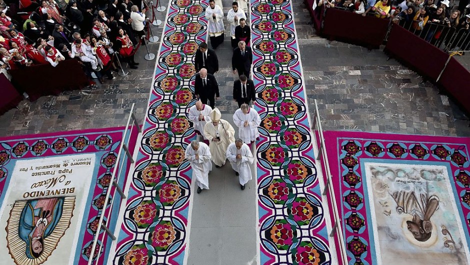 Pope Francis (C) arrives to celebrate a Holy Mass in the Basilica of Our Lady of Guadalupe in Mexico on February 13, 2016. Pope Francis is in Mexico for a trip encompassing two of the defining themes of his papacy: bridge-building diplomacy and his concern for migrants seeking a better life. AFP PHOTO / GABRIEL BOUYS / AFP / GABRIEL BOUYS (Photo credit should read GABRIEL BOUYS/AFP/Getty Images)