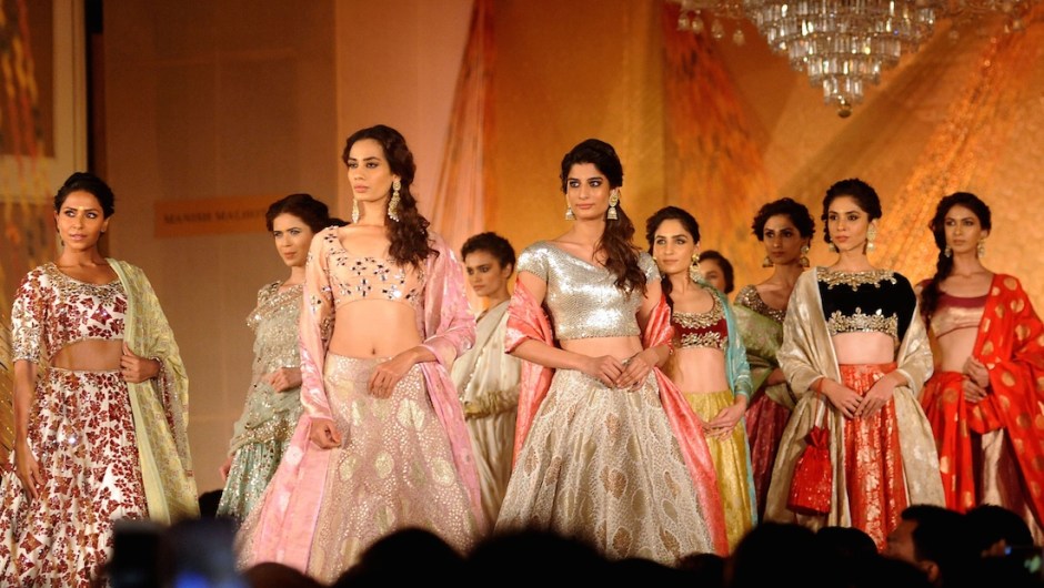 Indian models showcase creations by Manish Malhotra during the 'Regal Threads' charity fashion show in Mumbai on late January 14, 2016. AFP PHOTO / STR / AFP / STRDEL (Photo credit should read STRDEL/AFP/Getty Images)