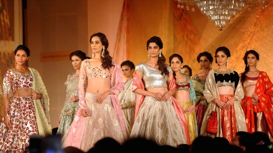 Indian models showcase creations by Manish Malhotra during the 'Regal Threads' charity fashion show in Mumbai on late January 14, 2016. AFP PHOTO / STR / AFP / STRDEL (Photo credit should read STRDEL/AFP/Getty Images)