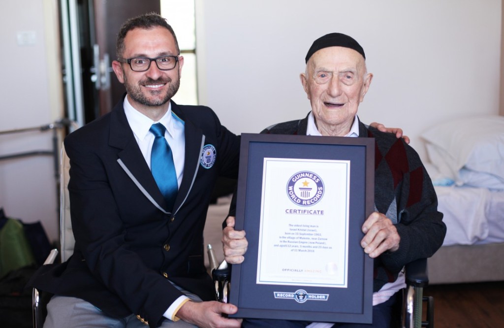 NEW WORLD'S OLDEST MAN ANNOUNCED BY GUINNESS WORLD RECORDS Marco Frigatti, Head of Records for Guinness World Records, presents Israel Kristal his certificate of achievement for Oldest living man on 11th March 2016, Haifa, Israel. Picture credit: Dvir Rosen/Guinness World Records