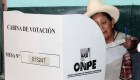 An indigenous woman casts her vote during general elections on April 10, 2016 in Cuzco. Almost 23 million Peruvians in Peru and abroad are expected to decide whether Keiko Fujimori, daughter of an ex-president jailed for massacres, should become their first female head of state in an election marred by alleged vote-buying and guerrilla attacks that killed four. / AFP / STR (Photo credit should read STR/AFP/Getty Images)