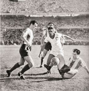 BUENOS AIRES, ARGENTINA - JANUARY 1: Argentinians Juan Carlos Fonda and Leon Strembel vies for the ball with Tesourinha(C) during a match for the 1946 Americas Football Cup Argentina won 2-0. AFP PHOTO (Photo credit should read AFP/AFP/Getty Images)