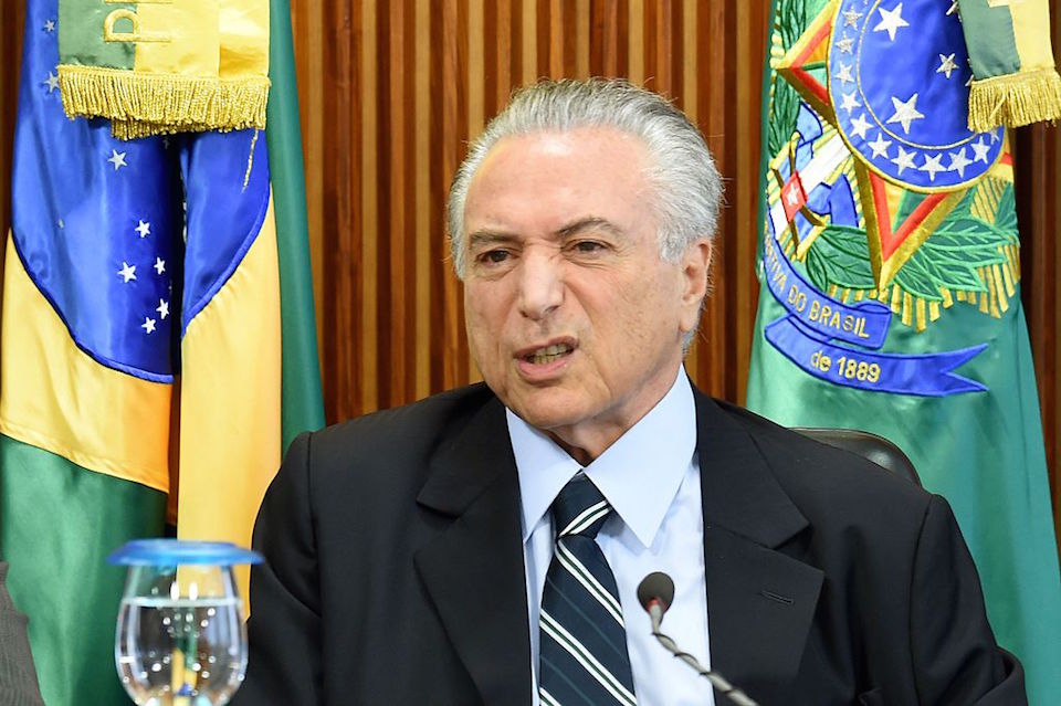 Brazilian acting President Michel Temer gestures during the first ministers meeting at the Planalto Palace in Brasilia, on May 13, 2016. Temer kicks off his new administration Friday, seeking to resuscitate the economy and steer clear of the corruption scandal that helped bring down his predecessor. / AFP / EVARISTO SA        (Photo credit should read EVARISTO SA/AFP/Getty Images)