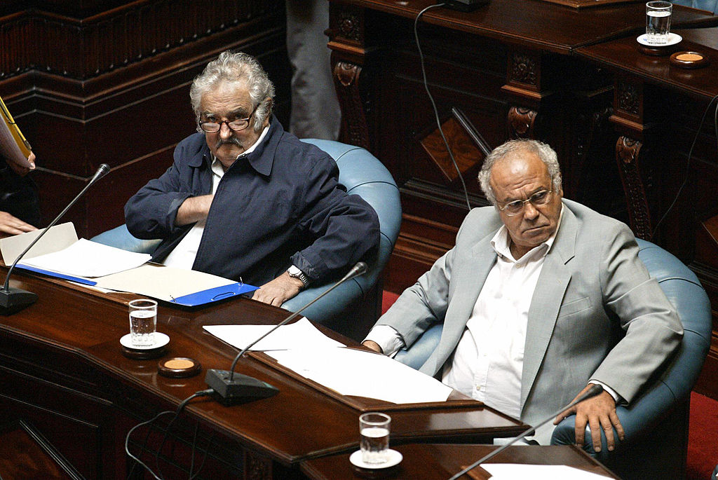 MONTEVIDEO, URUGUAY: The President of the new Uruguayan Senate, Jose Mujica (L) and senator Eleuterio Fernandez Huidobro, former guerrilla leaders of the leftist MLN-Tupamaros, who both spent 14 years in jail during the dictatorship (1973-1985) in Uruguay, take part in the Opening of the 46th session of the Parliament, 15 February 2005 in Montevideo. The two were the most voted in the general elections the past 31 October, when the candidate of the leftist coalition, Tabare Vazquez, was elected President. AFP PHOTO/Miguel ROJO (Photo credit should read 