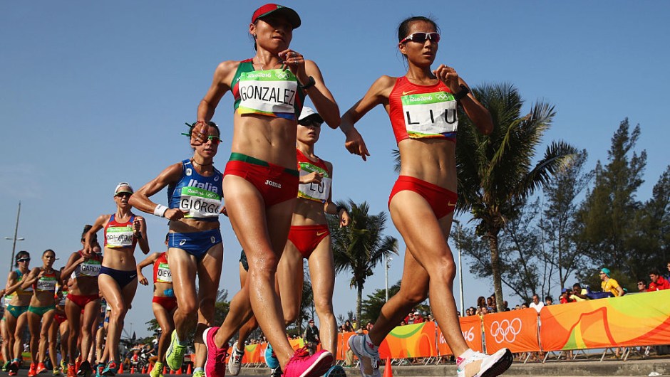 RIO DE JANEIRO, BRAZIL - AUGUST 19: Maria Guadalupe Gonzalez of Mexico and Hong Liu of China lead the group as they compete in the Women's 20km Walk final on Day 14 of the Rio 2016 Olympic Games at Pontal on August 19, 2016 in Rio de Janeiro, Brazil. (Photo by Julian Finney/Getty Images)