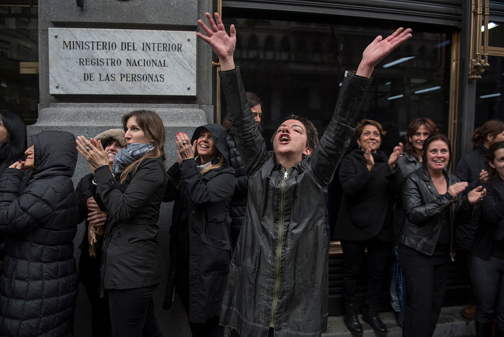 Women stop work and other activities for an hour to join a "women's strike" organized after the brutal killing of a 16-year-old girl, in Buenos Aires, on October 19, 2016. The brutal killing of a teenager who was allegedly raped and impaled on a spike by drug dealers has sparked outrage in Argentina. Lucia Perez, a high school student in the resort city of Mar del Plata, died on October 8 after being brought to the hospital by two men who said she had overdosed on drugs. But after doctors noticed signs of violent sexual penetration, investigators pieced together a different story. / AFP / Eitan ABRAMOVICH (Photo credit should read EITAN ABRAMOVICH/AFP/Getty Images)