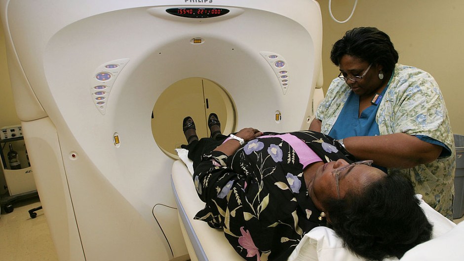 SAN FRANCISCO - AUGUST 17: Breast cancer patient Heraleen Broome, who is participating in a clinical trial, is helped by CT Tech Sandra Davis after she had a CT scan at the UCSF Comprehensive Cancer Center August 17, 2005 in San Francisco, California. The UCSF Comprehensive Cancer Center continues to use the latest research and technology to battle cancer and was recently rated 16th best cancer center in the nation by US News and World Report. (Photo by Justin Sullivan/Getty Images)