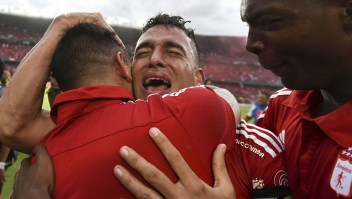America de Cali's team player Camilo Ayala celebrates after defeating Deportes Quindio in a Colombian Professional Football tournament promotion match in Cali, Colombia, on November 27, 2016. America de Cali defeated Deportes Quindio by 2-1 and returned to first division after five years. / AFP / LUIS ROBAYO (Photo credit should read LUIS ROBAYO/AFP/Getty Images)