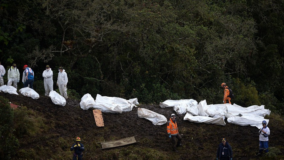 Rescue and forensic teams recover the bodies of victims of the LAMIA airlines charter that crashed in the mountains of Cerro Gordo, municipality of La Union, Colombia, on November 29, 2016 carrying members of the Brazilian football team Chapecoense Real. A charter plane carrying the Brazilian football team crashed in the mountains in Colombia late Monday, killing as many as 75 people, officials said. / AFP / STR / Raul ARBOLEDA (RAUL ARBOLEDA/AFP/Getty Images)