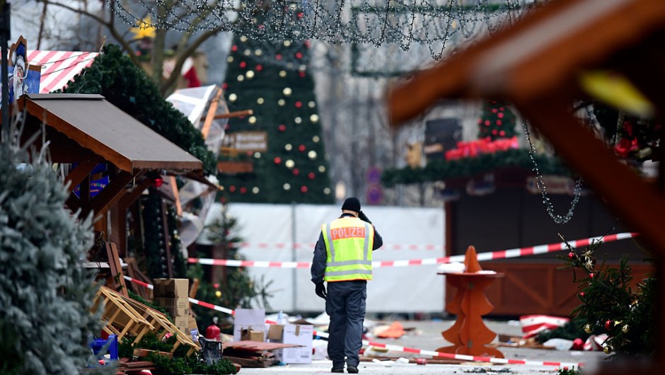 A policeman walks at the Christmas market near the Kaiser-Wilhelm-Gedaechtniskirche (Kaiser Wilhelm Memorial Church), the day after a terror attack, in central Berlin, on December 20, 2016. German police said they were treating as "a probable terrorist attack" the killing of 12 people when the speeding lorry cut a bloody swath through the packed Berlin Christmas market. / AFP / Tobias SCHWARZ (Photo credit should read TOBIAS SCHWARZ/AFP/Getty Images)