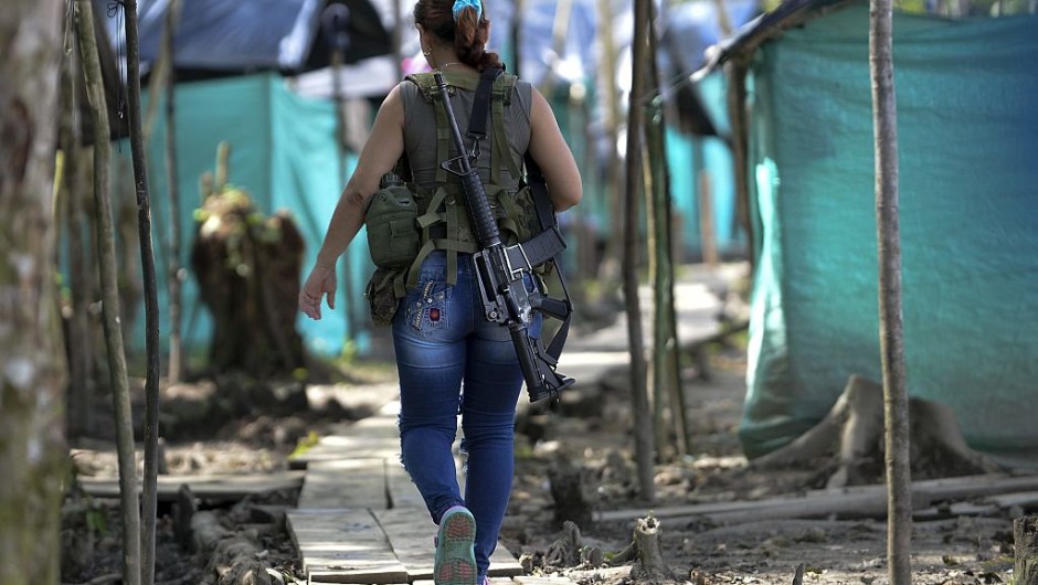 FARC guerrilla fighters walk in the Front 34 Alberto Martinez encampment after the New Year's celebration in Vegaez municipality, Antioquia department, Colombia on January 1, 2017. Colombia's Congress on Wednesday passed a law granting an amnesty to the Marxist FARC rebels as part of the country's peace deal, a development the government hailed as "historic." / AFP / STR / RAUL ARBOLEDA (Photo credit should read RAUL ARBOLEDA/AFP/Getty Images)