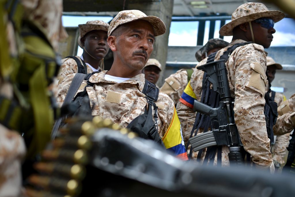 Members of the FARC guerrilla disembark in Buenaventura, Colombia, on February 4, 2017, from where they will go Sunday to UN-monitored transitional zones to hand in their weapons. Colombian FARC rebels started a historic disarmament process to end Latin America's last major armed conflict. / AFP / LUIS ROBAYO (Photo credit should read LUIS ROBAYO/AFP/Getty Images)