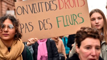 A woman carries a sign reading "We want rights, not flowers" during a demonstration march on March 8, 2017 in Toulouse, as part of International Women's Day. / AFP PHOTO / REMY GABALDA (Photo credit should read REMY GABALDA/AFP/Getty Images)