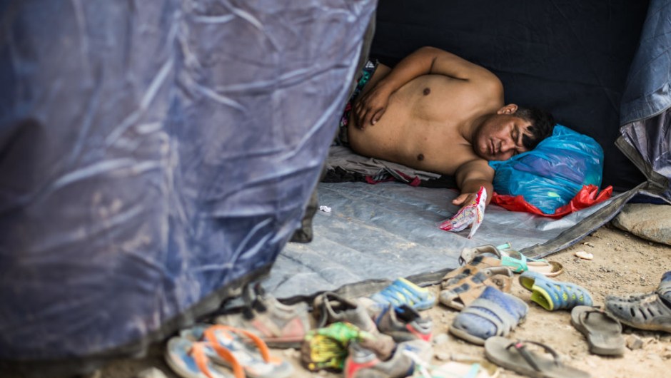 A local resident affected by the flash floods sleeps in one of the tents set up by volunteers and authorities in Huachipa district, east of Lima, on March 19, 2017. El Nino-fuelled flash floods and landslides hit parts of Lima, where most of the water distribution systems have collapsed due to unusual heavy seasonal downpours and people are facing drinking water shortages. / AFP PHOTO / Ernesto BENAVIDES (Photo credit should read ERNESTO BENAVIDES/AFP/Getty Images)