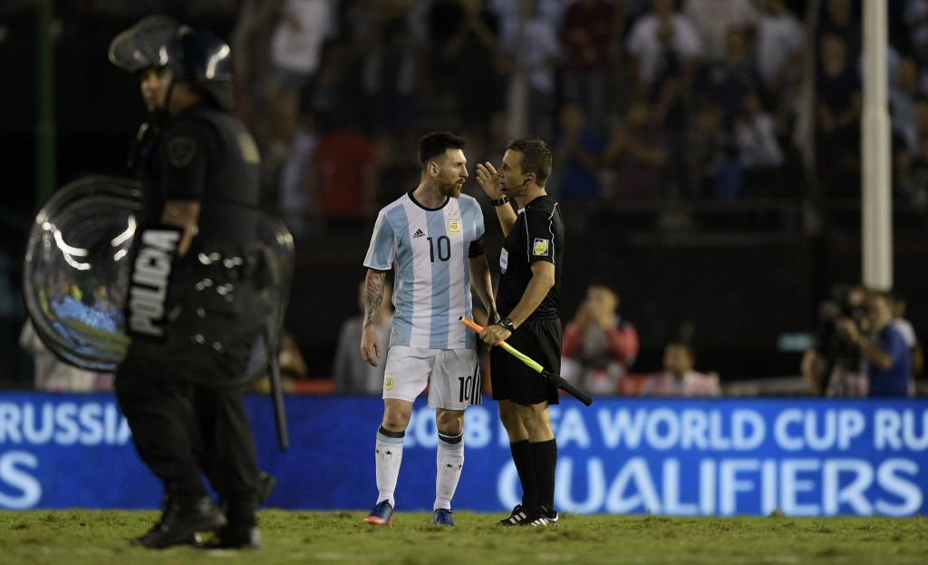 Argentina's Lionel Messi speaks with the linesman during their 2018 FIFA World Cup qualifier football match against Chile at the Monumental stadium in Buenos Aires, Argentina, on March 23, 2017. / AFP PHOTO / Juan Mabromata (Photo credit should read JUAN MABROMATA/AFP/Getty Images)