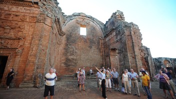 Tourists visit the Jesuitical ruins in Trinidad, Paraguay, on January 27, 2013. The finding of hexagonal tiles from the floor of a large Jesuitical temple built by Guarani indians in the XVII century, rekindled an ambicious project of rediscovering the ruins of the paradise lost when the Jesuits were expelled from the country in 1767. AFP PHOTO/NORBERTO DUARTE (Photo credit should read NORBERTO DUARTE/AFP/Getty Images)