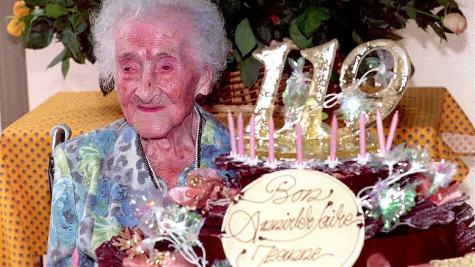Jeanne Calment, the world's oldest woman according to the Guinness Book of Records for the past three years, celebrates her 119th birthday 21 February 1994 in France. Calment, who weighs only 99 pounds, has been confined to a wheelchair in a nursing home since a hip operation in 1990. (Photo credit should read ERIC CABANIS/AFP/Getty Images)