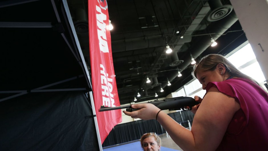 NATIONAL HARBOR, MD - FEBRUARY 23: Allie Vaccaro (R) of Elizabethtown, Pennsylvania, participates in a laser gun target practice at the NRA booth during the Conservative Political Action Conference at the Gaylord National Resort and Convention Center February 23, 2017 in National Harbor, Maryland. Hosted by the American Conservative Union, CPAC is an annual gathering of conservative politicians, commentators and their supporters. (Photo by Alex Wong/Getty Images)