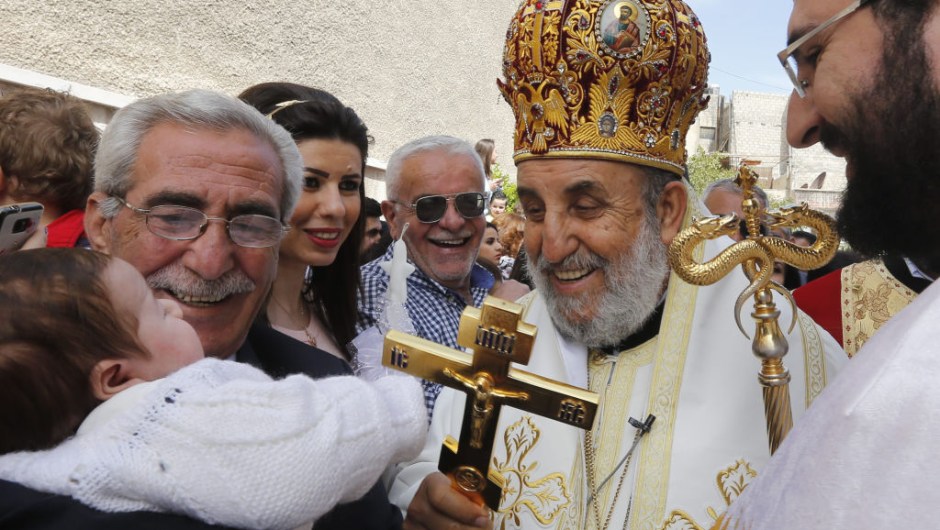 Syrian Christian Orthodox Bishop Moussa attends a parade marking Palm Sunday at the Church of Saint Elias in the Syrian capital Damascus on April 9, 2017. Palm Sunday is the final Sunday of Lent, the beginning of the Holy Week, and commemorates the triumphant arrival of Jesus Christ in Jerusalem, days before he was crucified. / AFP PHOTO / Louai Beshara (Photo credit should read LOUAI BESHARA/AFP/Getty Images)