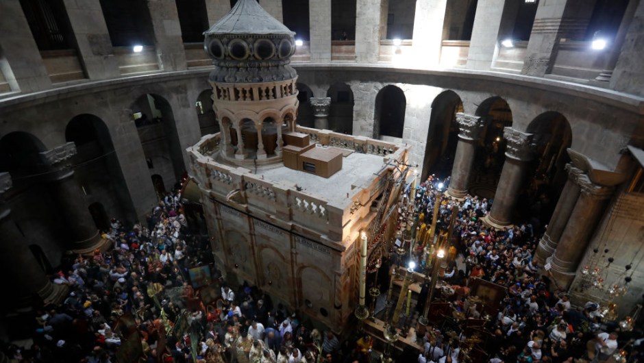 Christian Orthodox communities attend the Palm Sunday Easter procession at the Church of the Holy Sepulchre in Jerusalem's Old City on April 9, 2017. The ceremony is a landmark in the Roman Catholic calendar, marking the triumphant return of Christ to Jerusalem the week before his death, when a cheering crowd greeted him waving palm leaves. Palm Sunday marks the start of the most solemn week in the Christian calendar. / AFP PHOTO / GALI TIBBON (Photo credit should read GALI TIBBON/AFP/Getty Images)