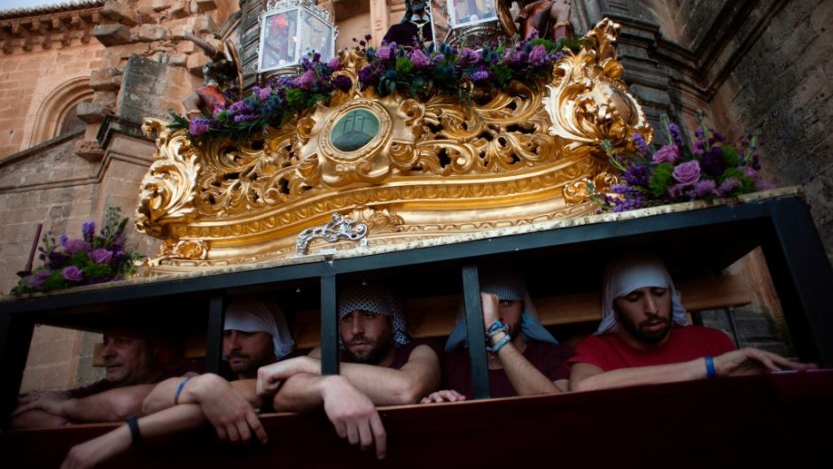 Penitents wait to carry a statue of the "Cristo de los Gitanos" (Christ of the Gypsies) during the "Gitanos" (The Gypsy) brotherhood procession on April 9, 2017 in Ronda, during the Holy Week. Christian believers around the world mark the Holy Week of Easter in celebration of the crucifixion and resurrection of Jesus Christ. / AFP PHOTO / JORGE GUERRERO (Photo credit should read JORGE GUERRERO/AFP/Getty Images)