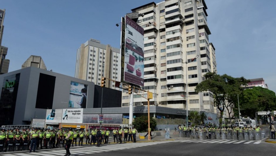 Riot police forces are deployed waiting for demonstrations in Caracas on April 19, 2017. Venezuela braced for rival demonstrations Wednesday for and against President Nicolas Maduro, whose push to tighten his grip on power has triggered waves of deadly unrest that have escalated the country's political and economic crisis. / AFP PHOTO / FEDERICO PARRA (Photo credit should read FEDERICO PARRA/AFP/Getty Images)