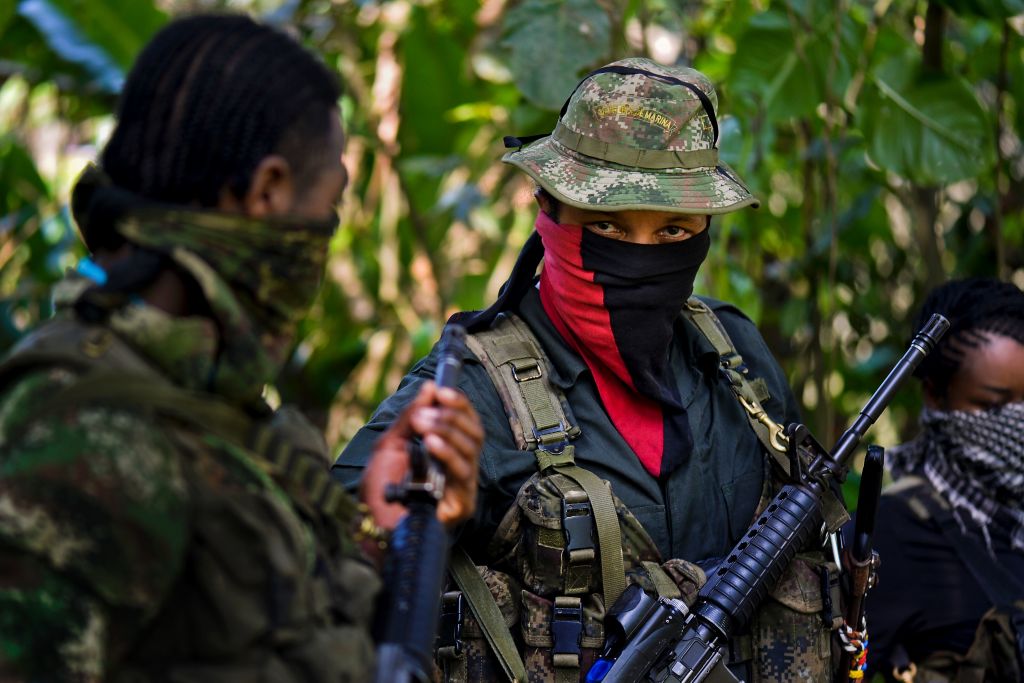 This photo taken on January 26, 2017 shows Danilo Hernandez, (C) commander of the Western Front of War Cimarron Resistance of the National Liberation Army (ELN), during an interview with AFP in Alto Baudo, in the department of Choco. Colombia's last active rebel force, the leftist National Liberation Army (ELN), promises to release a hostage on February 2 to clear the way for peace talks with the government. Deep differences remain with the ELN, as one of its western commanders, Danilo Hernandez, told AFP in an interview in the jungle this week. / AFP / LUIS ROBAYO / TO GO WITH Colombia-conflict-peace-ELN,INTERVIEW by Alina DIESTE (Photo credit should read LUIS ROBAYO/AFP/Getty Images)