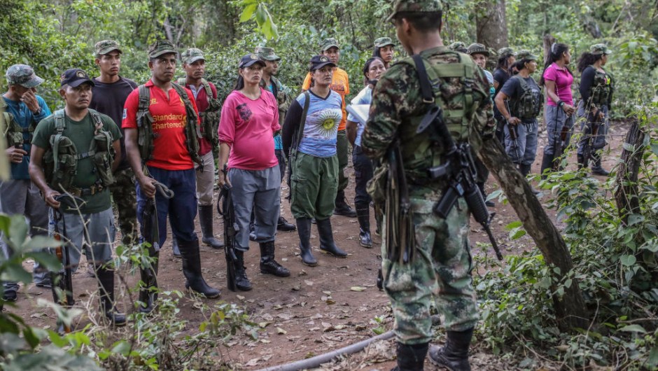FARC guerrillas fall in during a review at their camp in the Transitional Standardization Zone in Pondores, La Guajira department, Colombia on April 3, 2017. The Colombian government reported that the FARC guerrillas provided a total list with the names of the 6,084 members of the rebel group who have gathered in 26 "standardization zones" across the country, where they are building accomodations that will house them until the end of the disarmament process, outlined in the peace agreement reached in November 2016. / AFP PHOTO / Joaquin Sarmiento (Photo credit should read JOAQUIN SARMIENTO/AFP/Getty Images)