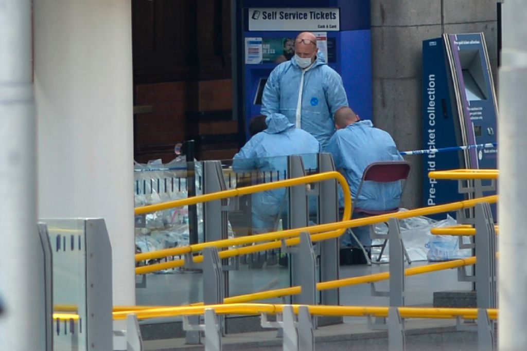 TOPSHOT - Forensics officers work at the scene at Manchester Victoria station in central Manchester, northwest England on May 23, 2017 following a deadly terror attack at a concert at the exit of the adjoining Manchester Arena the night before. Twenty two people have been killed and dozens injured in Britain's deadliest terror attack in over a decade after a suspected suicide bomber targeted fans leaving a concert of US singer Ariana Grande in Manchester. / AFP PHOTO / Ben Stansall (Photo credit should read BEN STANSALL/AFP/Getty Images)