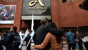 People attend a tribute for the victims a day after three women were killed in a bomb attack at the Andino mall, in Bogota, on June 18, 2017. Colombia's leaders and main rebel groups pledged Sunday that a mall bombing would not disrupt the country's peace process, even as authorities scrambled to find out who was behind the carnage. The victims -- two Colombians and a Frenchwoman -- perished when a device exploded in a ladies' restroom in the crowded Andino shopping centre in Bogota on Saturday. At least nine people were also wounded, officials said. / AFP PHOTO / Raul ARBOLEDA (Photo credit should read RAUL ARBOLEDA/AFP/Getty Images)