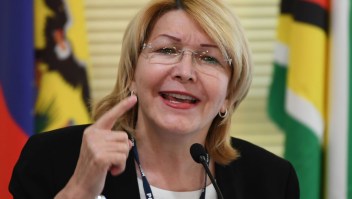 Venezuela's fugitive former top prosecutor Luisa Ortega, one of President Nicolas Maduro's most vocal critics, speaks, invited by Brazil's prosecutor general Rodrigo Janot, during a conference with representatives from the Latin American regional trading alliance Mercosur, in Brasilia, on August 23, 2017. Ortega promised to use the international forum in Brazil to intensify corruption allegations against Maduro, who called for her arrest. Days after a dramatic escape from Venezuela, Ortega arrived in Brasilia promising to dish dirt on Maduro, who in turn asked Interpol to put out a "red notice" warrant for his critic. / AFP PHOTO / EVARISTO SA (Photo credit should read EVARISTO SA/AFP/Getty Images)