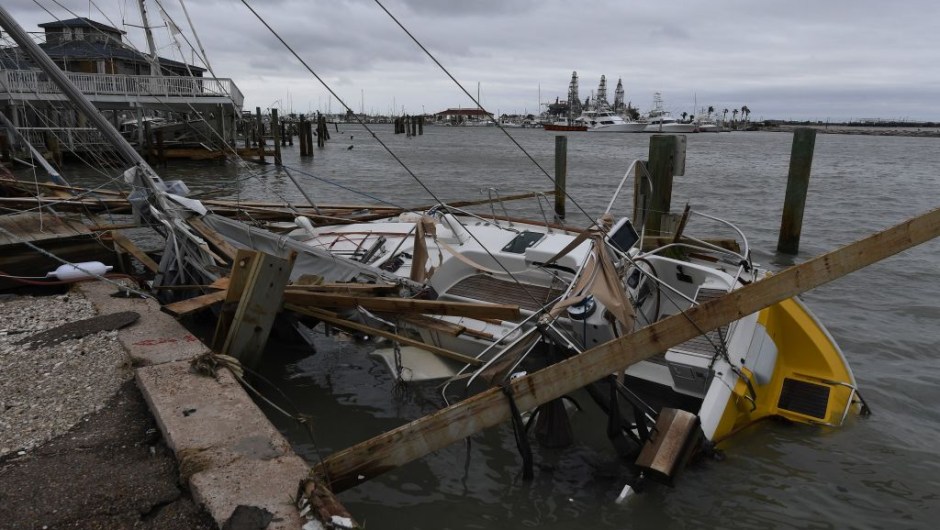 A sunken boat in the marina after Hurricane Harvey hit Port Aransas, Texas on August 27, 2017. Hurricane Harvey hit the Texas coast with forecasters saying its possible for up to three feet of rain and 125 mpg wind. / AFP PHOTO / MARK RALSTON (Photo credit should read MARK RALSTON/AFP/Getty Images)