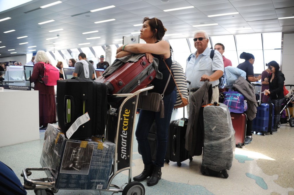 People crowd Fort Lauderdale International Airport as evacuation is underway for the arrival of Hurricane Irma, September 7, 2017 in Fort Lauderdale, Florida. Hurricane Irma, one of the most powerful Atlantic storms on record, cut a deadly swath through a string of small Caribbean islands and was on a collision course with Puerto Rico and potentially south Florida. / AFP PHOTO / Michele Eve Sandberg (Photo credit should read MICHELE EVE SANDBERG/AFP/Getty Images)