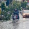 People drive along a flooded street in Punta Cana, in the Dominican Republic, as Hurricane Maria approaches on September 20, 2017. The government of the Dominican Republic told people to stay home from their public and private sector jobs on Thursday, when the hurricane is expected to hit the island. / AFP PHOTO / Erika SANTELICES (Photo credit should read ERIKA SANTELICES/AFP/Getty Images)