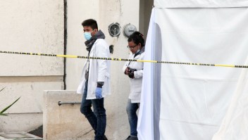 Forensic personnel work on a crime scene where attackers burst during a party and murdered 11 people in Tizayuca, Hidalgo state, Mexico, on July 13, 2017. Gunmen burst into a home in central Mexico during a party and killed 11 people, authorities and media reports said Thursday, the violence-plagued country's latest mass murder. Police found the gory scene when they responded to an emergency call received just after midnight in the city of Tizayuca, in the central state of Hidalgo, the state security service said in a statement. / AFP PHOTO / ALDO FALCON (Photo credit should read ALDO FALCON/AFP/Getty Images)