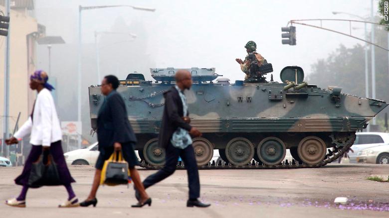 An armed soldier patrols a street in Harare, Zimbabwe, Wednesday, Nov. 15, 2017. Zimbabwe's army said Wednesday it has President Robert Mugabe and his wife in custody and is securing government offices and patrolling the capital's streets following a night of unrest that included a military takeover of the state broadcaster. (AP Photo)
