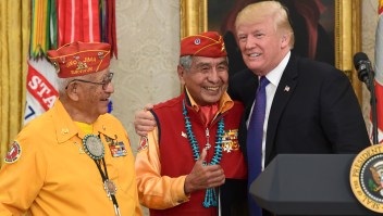 President Donald Trump, right, meets with Navajo Code Talkers Peter MacDonald, center, and Thomas Begay, left, in the Oval Office of the White House in Washington, Monday, Nov. 27, 2017. (AP Photo/Susan Walsh