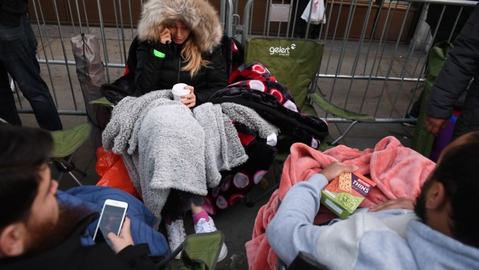 People queue outside Apple's Regent Street store in central London on November 3, 2017 waiting for the store to open on the say of the launch of the Apple iPhone X. Apple's flagship iPhone X hit stores on November 3, as the world's most valuable company predicted bumper sales despite the handset's eye-watering price tag and celebrated a surge in profits. The device features facial recognition, cordless charging and an edge-to-edge screen made of organic light-emitting diodes used in high-end televisions. It marks the 10th anniversary of the first iPhone release and is released in about 50 markets around the world. / AFP PHOTO / Chris J Ratcliffe (Photo credit should read CHRIS J RATCLIFFE/AFP/Getty Images)