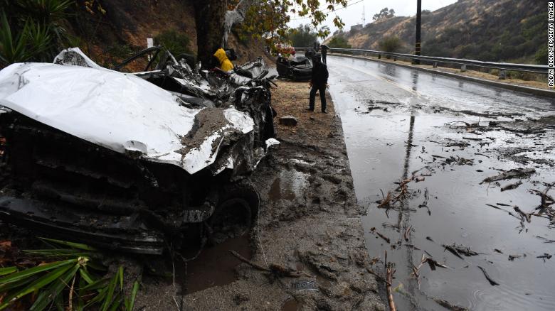 Mud fills a street after a rain-driven mudslide destroyed two cars and damaged property in a neighborhood under mandatory evacuation in Burbank, California, January 9, 2018. Mudslides unleashed by a ferocious storm demolished homes in southern California, authorities said Tuesday. Five people were reported killed. / AFP PHOTO / Robyn Beck (Photo credit should read ROBYN BECK/AFP/Getty Images)