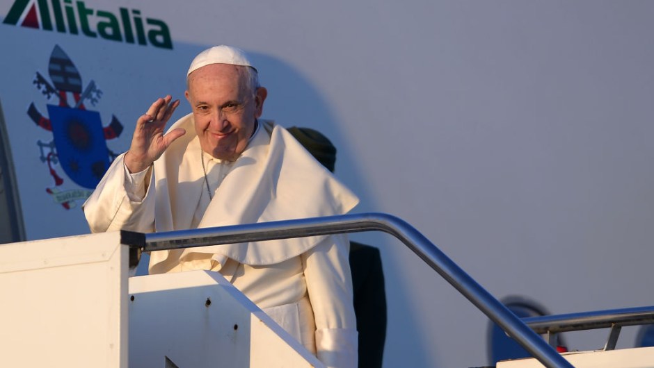 Pope Francis waves as he boards a plane at Rome's Fiumicino Airport on January 15, 2018 for his trip to Chile. Pope Francis set off on a trip to Chile and Peru, a seven-day Latin-American visit which will see the pontiff rally a flagging local church on his home continent. / AFP PHOTO / FILIPPO MONTEFORTE (Photo credit should read FILIPPO MONTEFORTE/AFP/Getty Images)