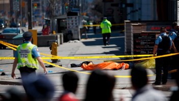 TORONTO, ON - APRIL 23: A tarp lays on top of a body on Yonge St. at Finch Ave. after a van plowed into pedestrians on April 23, 2018 in Toronto, Canada. A suspect is in custody after a white van collided with multiple pedestrians. (Photo by Cole Burston/Getty Images)