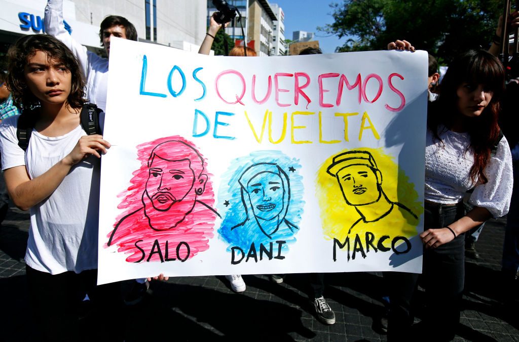 Students take part in a protest to demand the appearance of three missing film students alive, three days after they went missing in Guadalajara, Jalisco state, Mexico, on March 22, 2018. Three film students from the University of Audiovisual Media of Jalisco state went missing last Monday. According to the denounce they were intercepted when they were returning from a shooting in the western locality of Tonala. Mexican Oscar-winning director Guillermo del Toro, native from Guadalajara, joined in the claim through Twitter. / AFP PHOTO / Ulises Ruiz (Photo credit should read ULISES RUIZ/AFP/Getty Images)