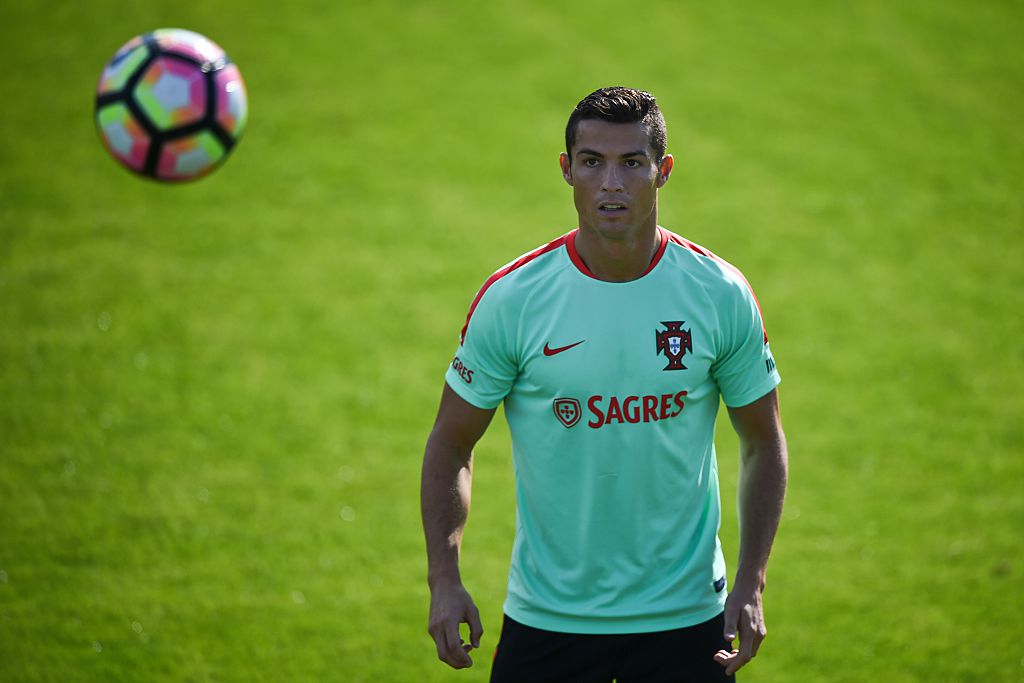 Portugal's forward Cristiano Ronaldo eyes the ball during a training session at "Cidade do Futebol" (Football City) training camp in Oeiras, outskirts of Lisbon on October 6, 2016 on the eve of the FIFA World Cup Russia 2018 qualifier match Portugal vs Andorra. / AFP / PATRICIA DE MELO MOREIRA (Photo credit should read PATRICIA DE MELO MOREIRA/AFP/Getty Images)