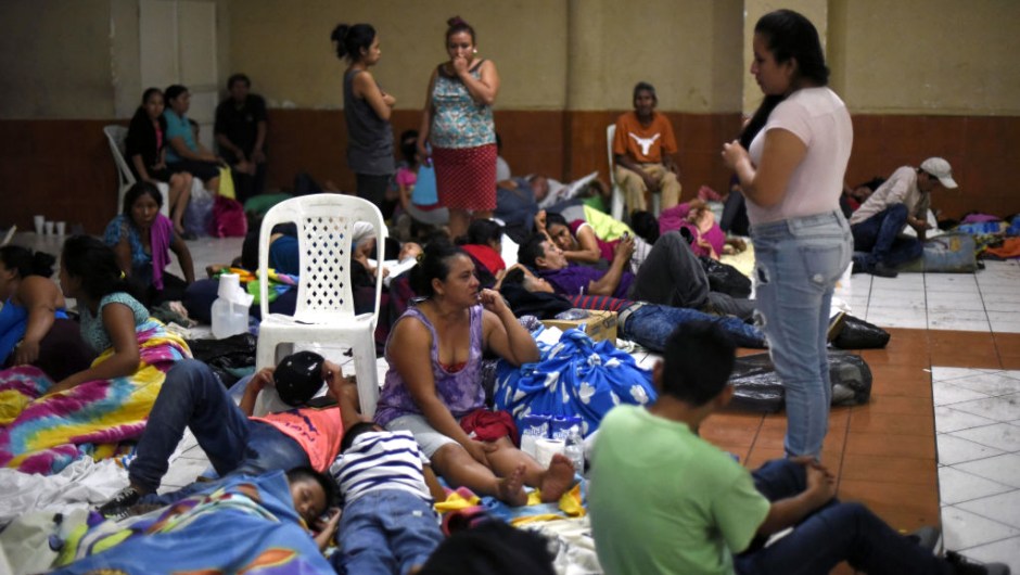 EDITORS NOTE: Graphic content / Residents of several communities safeguard in a temporary shelter in Escuintla department, 35 km south of Guatemala City on June 3, 2018, for fear of new outbursts of Fuego volcano. - At least 25 people were killed, according to the National Coordinator for Disaster Reduction (Conred), when Guatemala's Fuego volcano erupted Sunday, belching ash and rock and forcing the airport to close. (Photo by JOHAN ORDONEZ / AFP) (Photo credit should read JOHAN ORDONEZ/AFP/Getty Images)