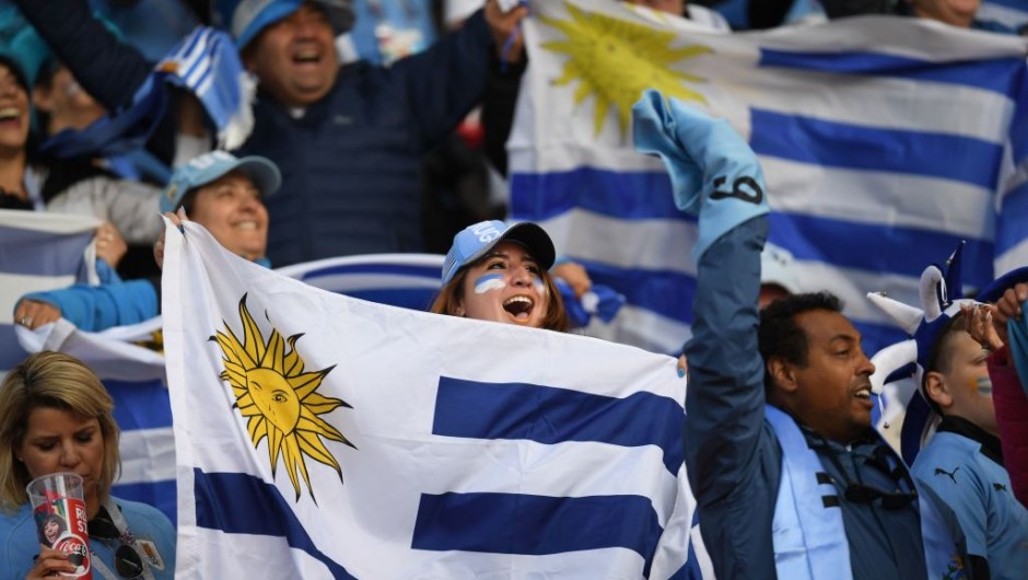 Uruguay fans hold flags before kick off of the Russia 2018 World Cup Group A football match between Egypt and Uruguay at the Ekaterinburg Arena in Ekaterinburg on June 15, 2018. (Photo by JORGE GUERRERO / AFP) / RESTRICTED TO EDITORIAL USE - NO MOBILE PUSH ALERTS/DOWNLOADS (Photo credit should read JORGE GUERRERO/AFP/Getty Images)