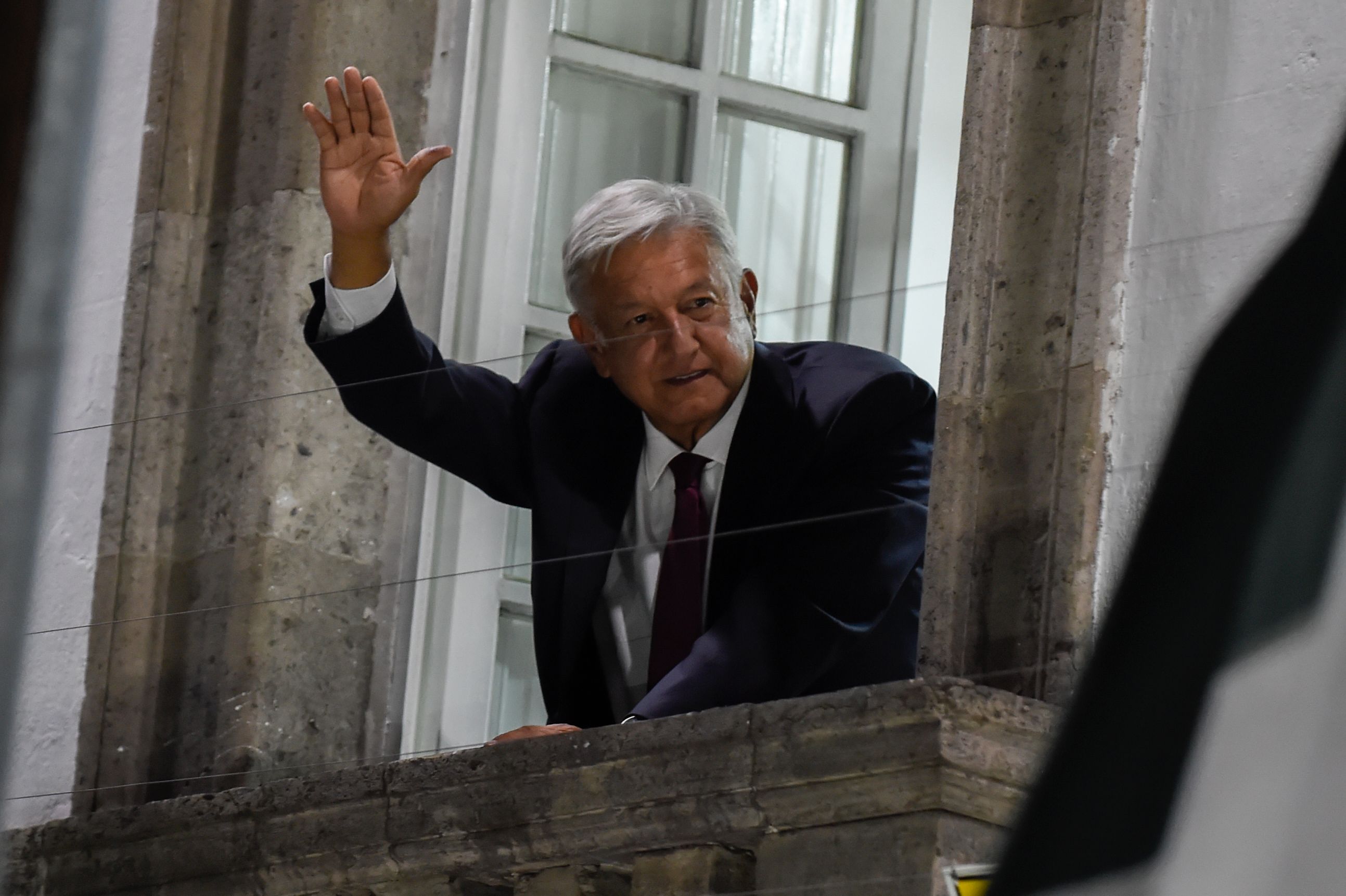 Newly elected Mexico's President Andres Manuel Lopez Obrador, running for "Juntos haremos historia" party, waves to his supporters after winning general elections, in Mexico City, on July 1, 2018. - Anti-establishment leftist Andres Manuel Lopez Obrador won Mexico's presidential election Sunday by a large margin, according to exit polls, in a landmark break with the parties that have governed for nearly a century. (Photo by ALFREDO ESTRELLA / AFP) (Photo credit should read ALFREDO ESTRELLA/AFP/Getty Images)