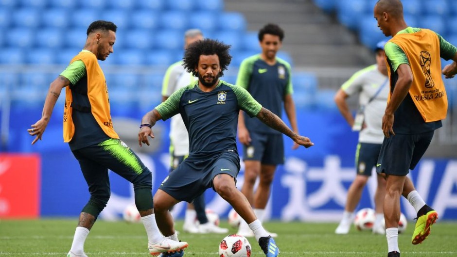 Brazil's forward Neymar (L) and Brazil's defender Marcelo (2nd L) take part in a training session at the Samara Arena in Samara on July 1, 2018, on the eve of their Russia 2018 World Cup round of 16 football match against Mexico. (Photo by Fabrice COFFRINI / AFP) (Photo credit should read FABRICE COFFRINI/AFP/Getty Images)